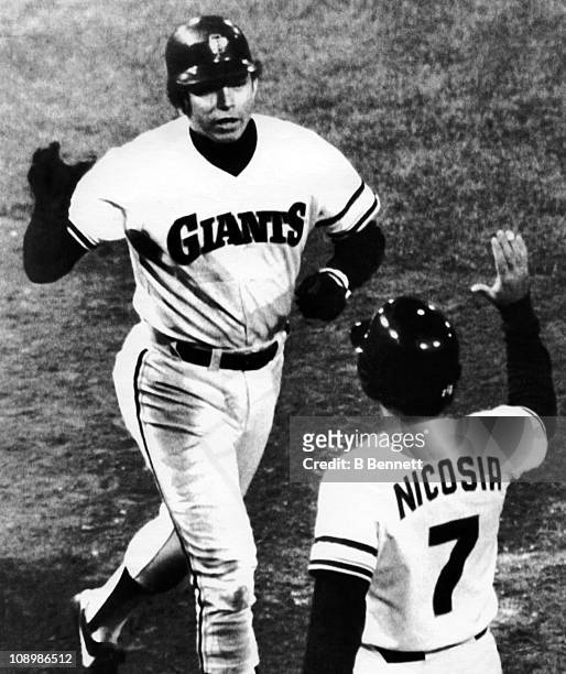 Darrell Evans of the San Francisco Giants is congratulated by teammate Steve Nicosia after Evans hit a home run during their game against the...