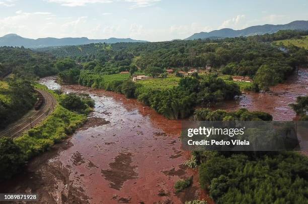 Aerial view mudslides area a day after the collapse of a dam at an iron-ore mine belonging to Brazil's giant mining company Vale on January 26, 2019...