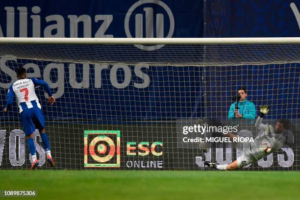 Sporting's Brazilian goalkeeper Renan Ribeiro stops a penalty shot by Porto's Portuguese forward Hernani during the penalty shootout of the...