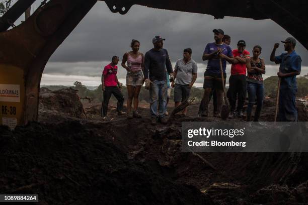 Residents survey damage after a Vale SA dam burst in Brumadinho, Minas Gerais state, Brazil, on Saturday, Jan. 26, 2019. A Brazilian judge has...