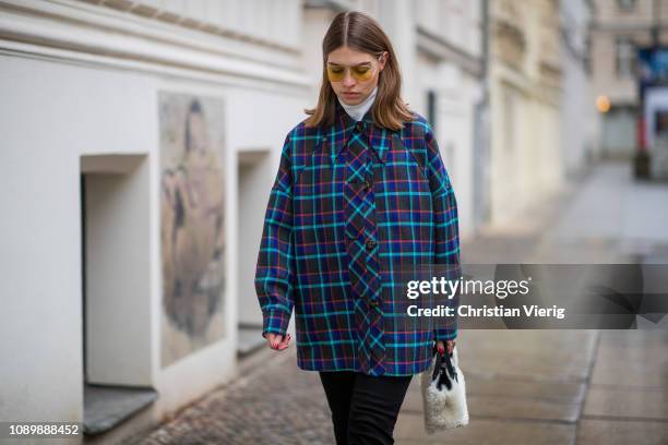 Swantje Soemmer is seen wearing blue checked Missoni jacket, black ripped denim jeans Boden, Marc Jacobs sunglasses, AGL cowboy boots, Longchamp bag...