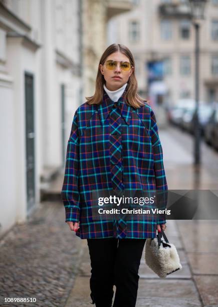 Swantje Soemmer is seen wearing blue checked Missoni jacket, black ripped denim jeans Boden, Marc Jacobs sunglasses, AGL cowboy boots, Longchamp bag...