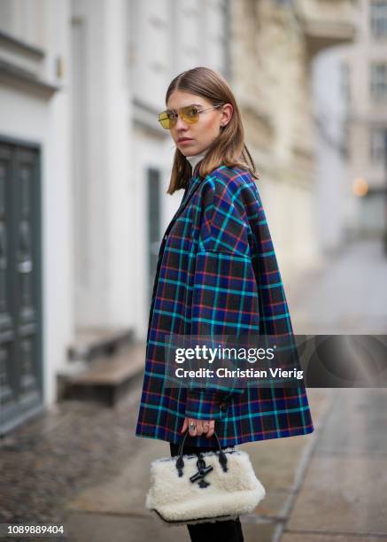 Swantje Soemmer is seen wearing blue checked Missoni jacket, black ripped denim jeans Boden, Marc Jacobs sunglasses, AGL cowboy boots, Longchamp bag...