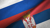 Serbia and Russia two flags together realations textile cloth fabric texture