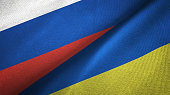 Ukraine and Russia two flags together realations textile cloth fabric texture