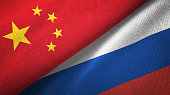 Russia and China two flags together realations textile cloth fabric texture
