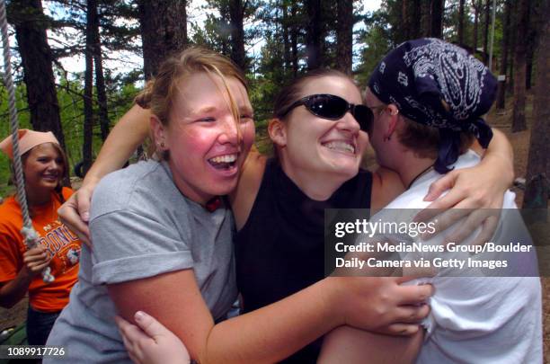 June 4, 2004 / Allenspark CO / Christy Fisher, left, of Canyon City CO, Kali Holder from Daytona Beach FL, and Laurel Kidd From Masonville CO., hug...