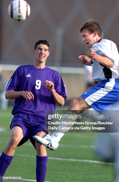 October 19, 2004 / Lafayette Colo / Holy Family's Tyler Sullivan watchs Peak to Peak's Nathan Seitz head the ball away during the Peak to Peak vs...