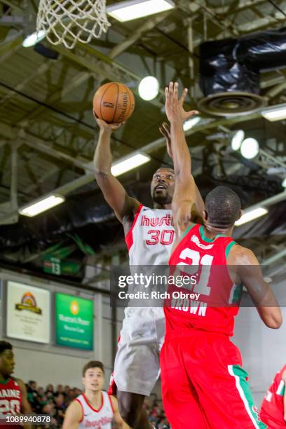 Kyle Casey of the Memphis Hustle shoots over Vitto Brown of the Maine Red Claws on Saturday, January 26, 2019 at the Portland Expo in Portland,...