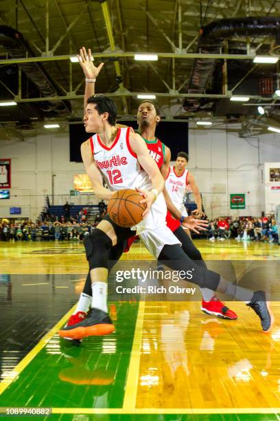 Yuta Watanabe of the Memphis Hustle drives against Andrew White of the Maine Red Claws on Saturday, January 26, 2019 at the Portland Expo in...