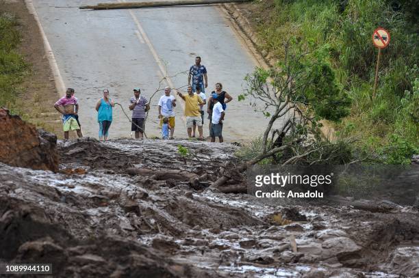 Locals wait at the scene after a tailings dam collapsed at an iron ore mine in Brumadinho, state of Minas Gerias, in southeastern Brazil, on January...