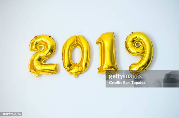 a gold-colored 2019 inflated balloon - new years eve 2019 stock pictures, royalty-free photos & images