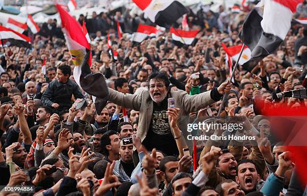 An anti-government protester is carried on shoulders in Tahrir Square in the afternoon before a speech by Egyptian President Hosni Mubarak in Tahrir...