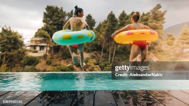 swimming pool jump - swimming pool jump stock pictures, royalty-free photos & images