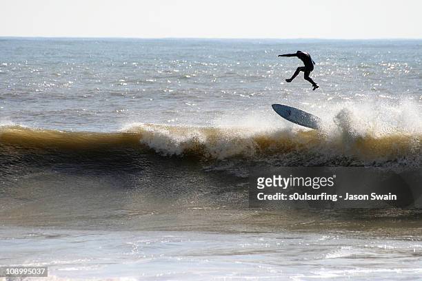 surfing at freshwater bay, isle of wight. gravity - s0ulsurfing stock pictures, royalty-free photos & images