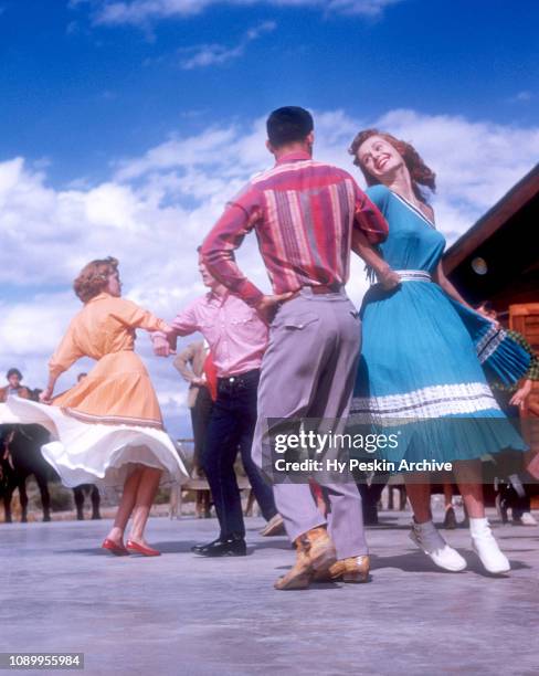 Phoenix college students square dance outside of the Arizona Star at Western Saddle Club on October 28, 1954 in Phoenix, Arizona.