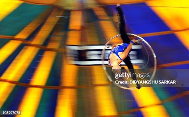 An Indian circus artist performs during the Great Bombay Circus show in Bangalore on January 28, 2011. Once a major form of mass entertainment, the...