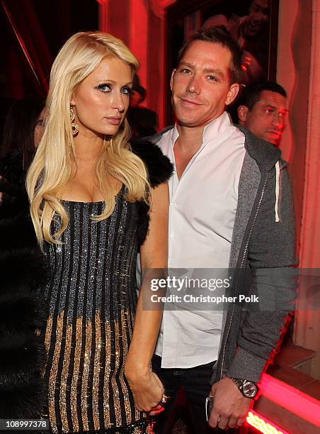 Personality Paris Hilton and Cy Waits attend the RED launches with Usher on February 10, 2011 in Hollywood, California.