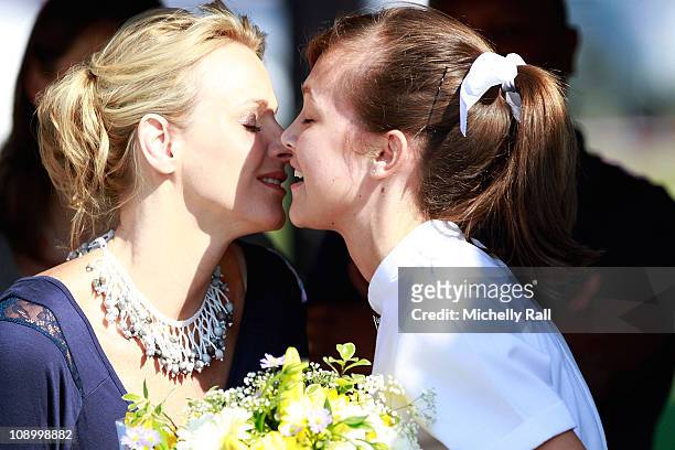Charlene Wittstock, future Princess of Monaco , takes part in the ribbon cutting ceremony for the opening of the school swimming pool during a...