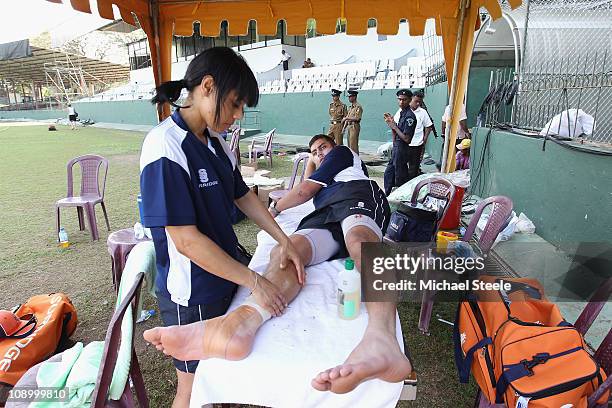 Bradley Kruger receives attention from physio Rene Naylor during the Netherlands practise session at the Sinhalese Sports Club on February 11, 2011...