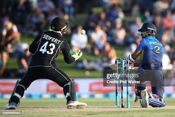 Kusal Mendis of Sri Lanka Ash Sodhi of the New Zealand Blackcaps caight behind by Tim Seifert of the New Zealand Blackcaps during game two in the One...