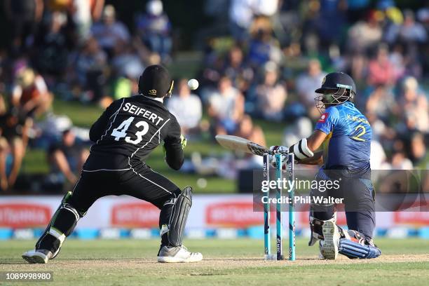 Kusal Mendis of Sri Lanka Ash Sodhi of the New Zealand Blackcaps caight behind by Tim Seifert of the New Zealand Blackcaps during game two in the One...