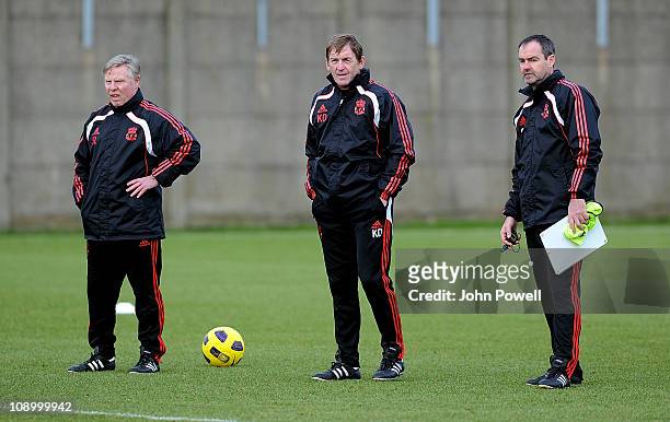 Liverpool assistant manager, Sammy Lee, manager, Kenny Dalglish and head coach, Steve Clarke during a Liverpool training session at Melwood Training...