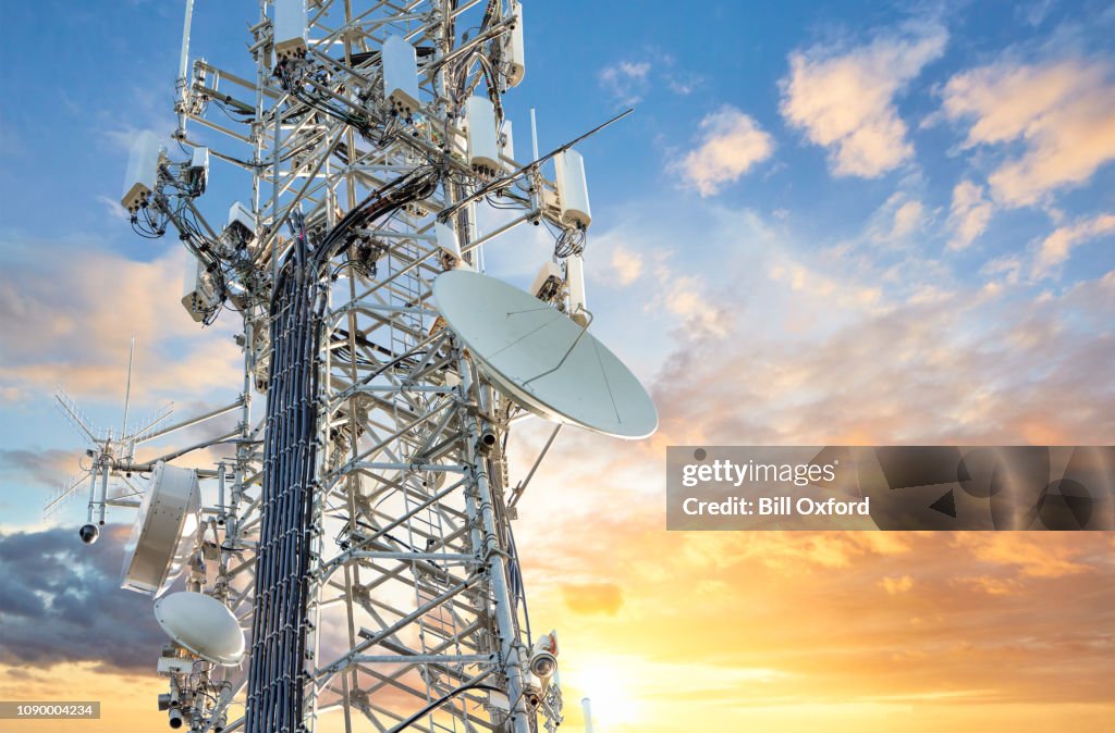 5G Sunset Cell Tower: Cellular communications tower for mobile phone and video data transmission