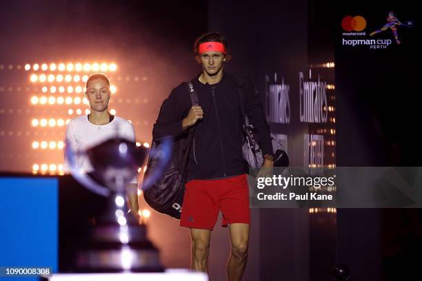 Angelique Kerber and Alexander Zverev of Germany walk out onto court past the Hopman Cup during day eight of the 2019 Hopman Cup at RAC Arena on...