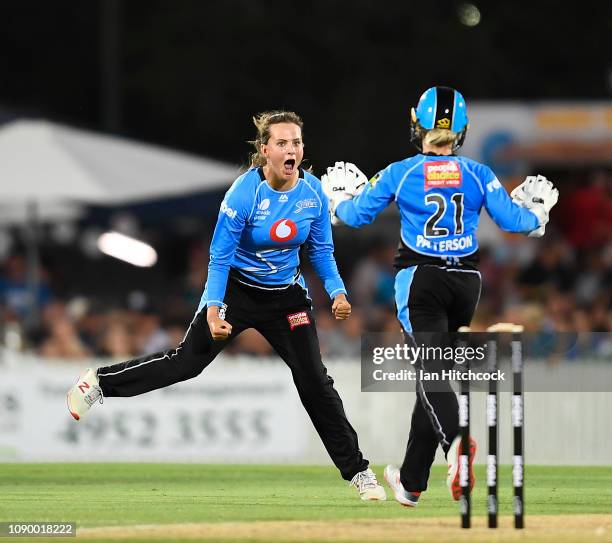 Alex Price of the Strikers celebrates the wicket of Jess Jonassen of the Heat during the Womens Big Bash League match between the Brisbane Heat and...