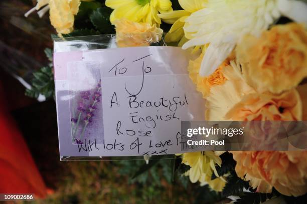 Floral tributes are left by mourners at the funeral of Joanna Yeates outside St Marks Church on February 11, 2001 in Ampfield, Hampshire, United...