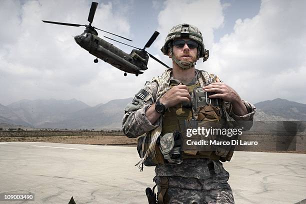 Civilian anthropologist and HTT Social Scientist, Ted Callahan, 35-years old, from Boston, Massachusetts waits on a landing strip for an helicopter...