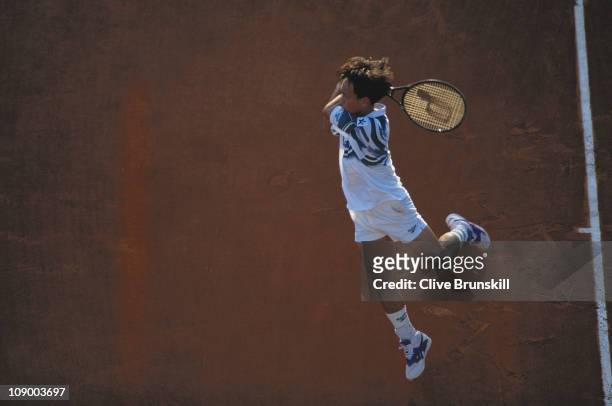 Michael Chang of the United States powers a return against Jaime Yzaga in their third round Men's Singles match during the French Open Tennis...