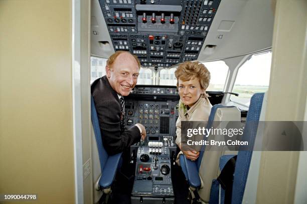 Neil Kinnock, leader of the Labour Party and member of Parliament, and his wife Glenys Kinnock, sit in the cockpit of a BAE 146 aircraft at the...