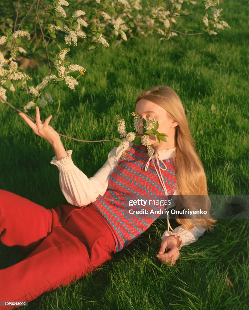 Portrait of beautiful young woman in flowers