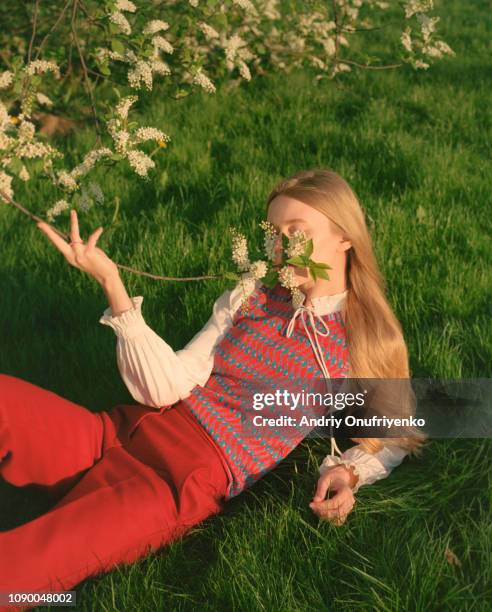 portrait of beautiful young woman in flowers - modell bildbanksfoton och bilder