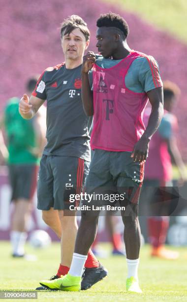 Head coach Niko Kovac gives instructions to Alphonso Davies during a training session at day two of the Bayern Muenchen training camp at Aspire...