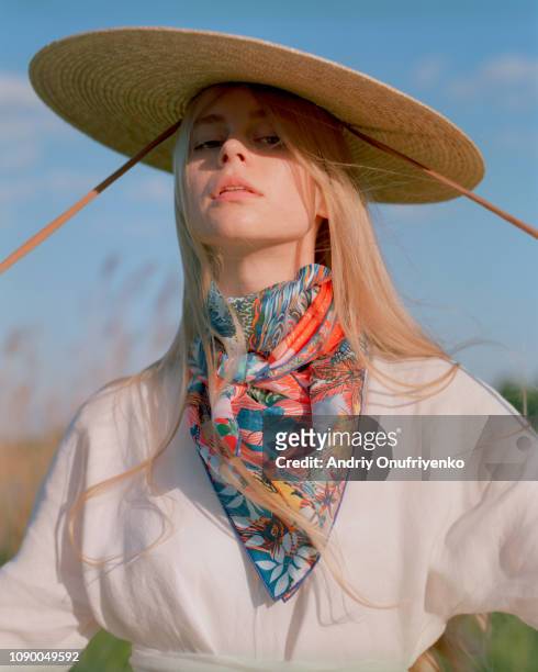 beautiful young woman near lake - blond model long hair 個照片及圖片檔