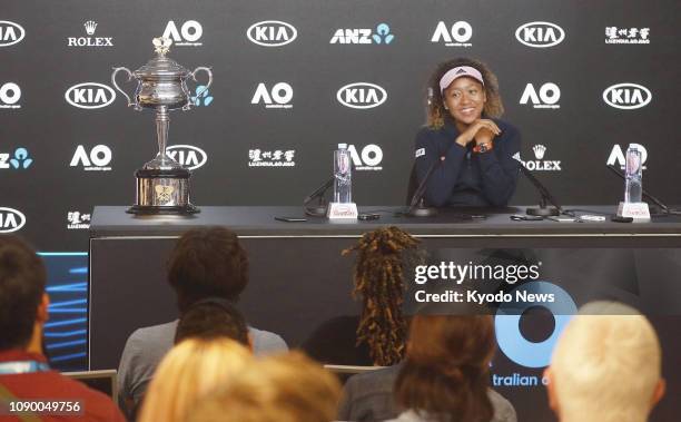 Naomi Osaka of Japan attends a press conference in the early hours of Jan. 27 after defeating Petra Kvitova of the Czech Republic in the women's...