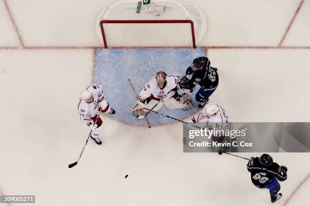 Dan Boyle of the San Jose Sharks, Cam Ward of the Carolina Hurricanes, Erik Karlsson of the Ottowa Senators all playing for Team Staal defend against...