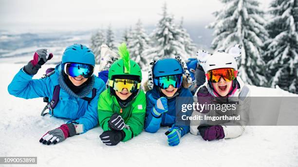 skiing family having fun on winter day - funny snow skiing stock pictures, royalty-free photos & images