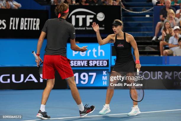 Alexander Zverev and Angelique Kerber of Germany celebrate a point during the mixed doubles match final against Roger Federer and Belinda Bencic of...