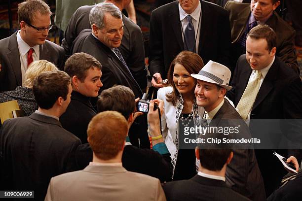 Rep. Michele Bachmann poses for photographs with supporters in the lobby of the Marriott Wardman Park hotel during the Conservative Political Action...