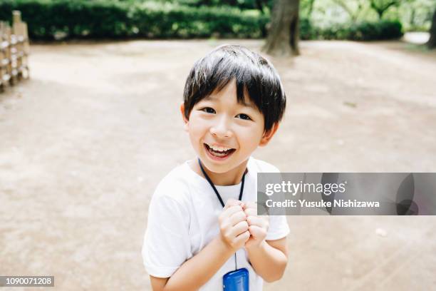 a boy who laughs at the camera - 8歳から9歳 ストックフォトと画像