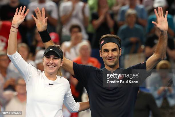 Roger Federer and Belinda Bencic of Switzerland celebrate winning the Hopman Cup against Alexander Zverev and Angelique Kerber of Germany on day...