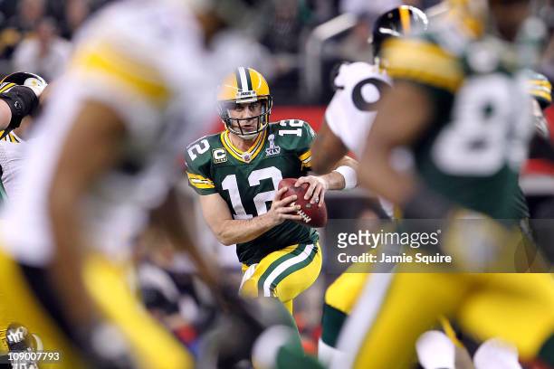 Aaron Rodgers of the Green Bay Packers looks to pass against the Pittsburgh Steelers during Super Bowl XLV at Cowboys Stadium on February 6, 2011 in...