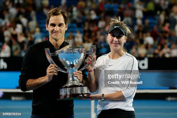 Roger Federer and Belinda Bencic of Switzerland with the Hopman Cup after defeating Angelique Kerber and Alexander Zverev of Germany in the final...