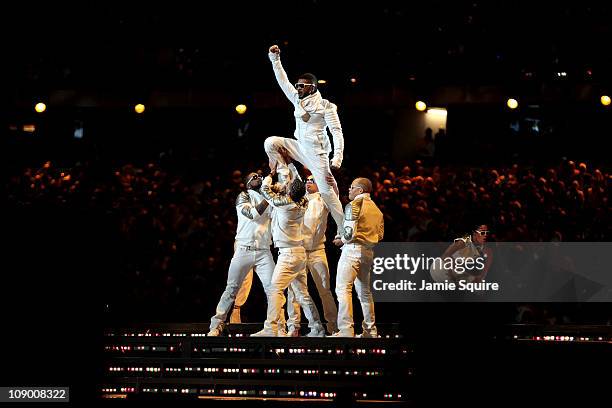 Usher performs with the Black Eyed Peas perform during the Bridgestone Super Bowl XLV Halftime Show at Cowboys Stadium on February 6, 2011 in...