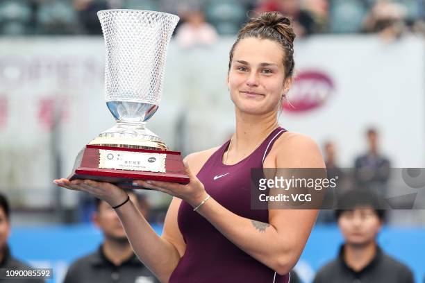 Gold medalist Aryna Sabalenka of Belarus poses with trophy after winning the women's singles final match against Alison Riske of United States on...
