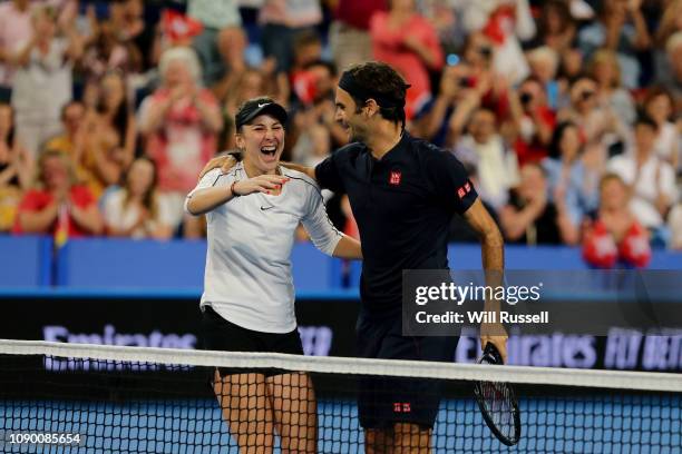 Roger Federer and Belinda Bencic of Switzerland celebrate winning the Hopman Cup after defeating Angelique Kerber and Alexander Zverev of Germany in...